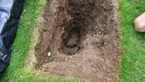 Motorcycle Buried in hole in Surrey